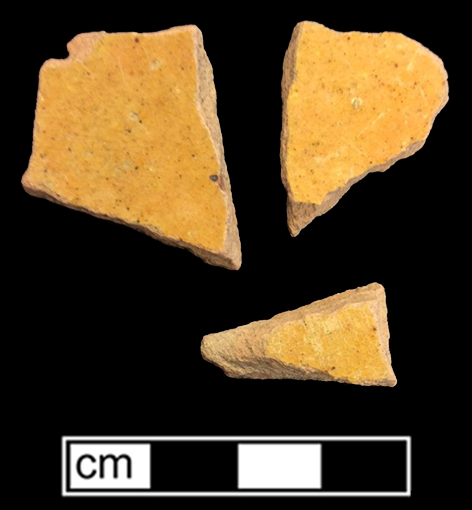 Indeterminate vessel of yellow border ware as identified by J. Pearce 1999. Glazed interior sherds on pink paste on top, and unglazed exterior sherds on bottom. 